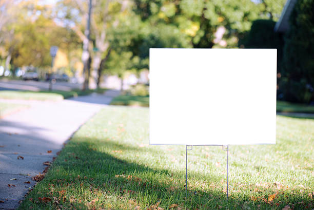white sign with clipping path on front lawn